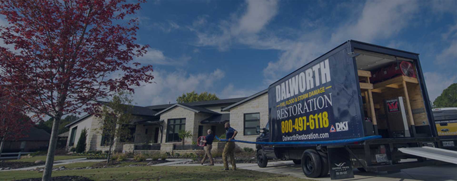 Dalworth Restoration's Truck and Crew members working on a restoration site